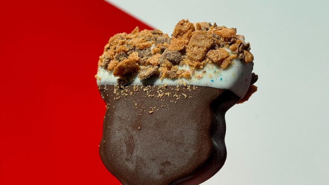 This Hand-Dipped Mickey’s Premium Ice Cream Bar is Topped With Butterfingers