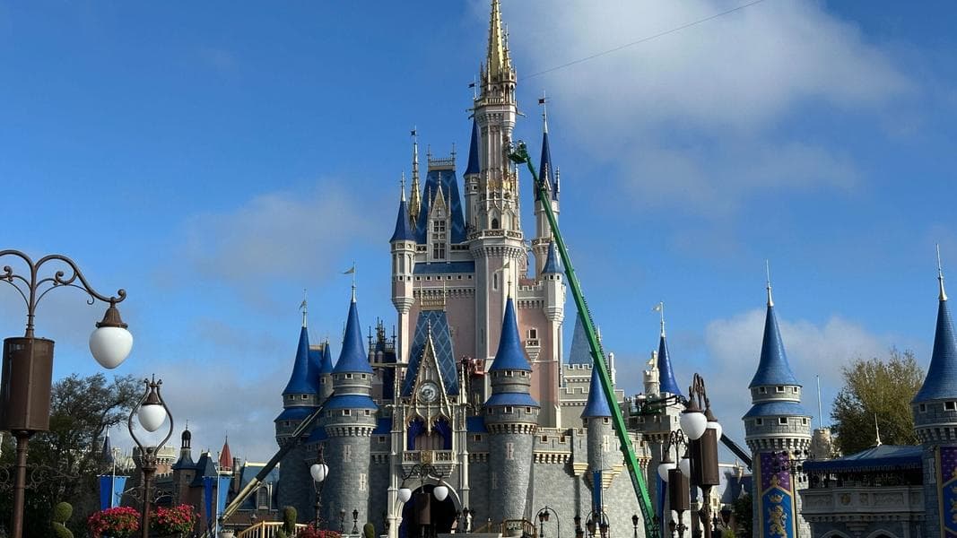 Cinderella Castle Painting Reaches Highest Gargoyles at Magic Kingdom
