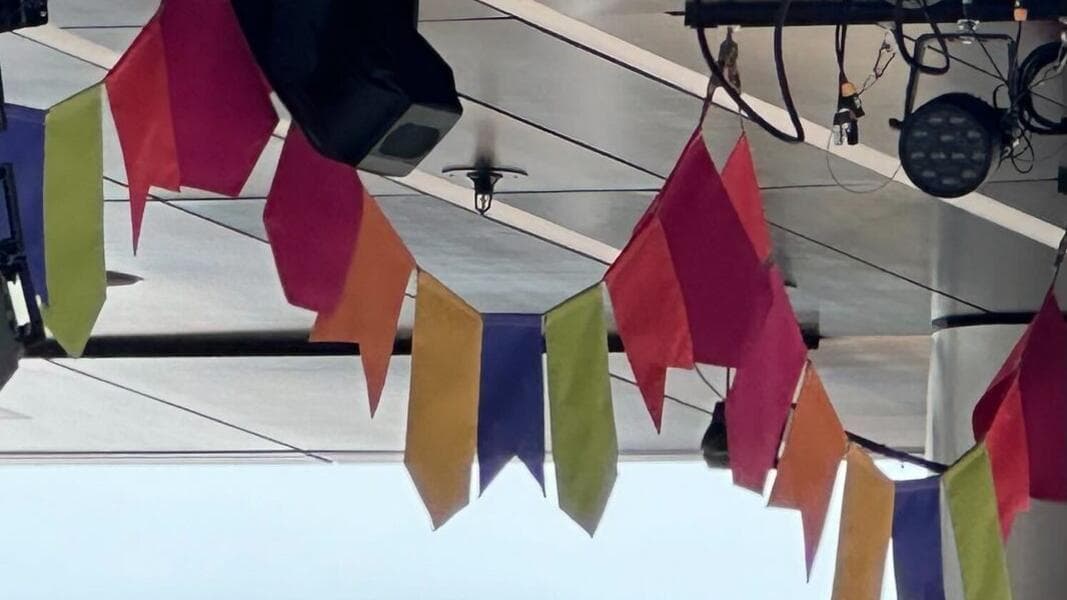 ‘Celebración Encanto’ Flags and ‘Festival Favorites’ Sign Installed at CommuniCore in EPCOT