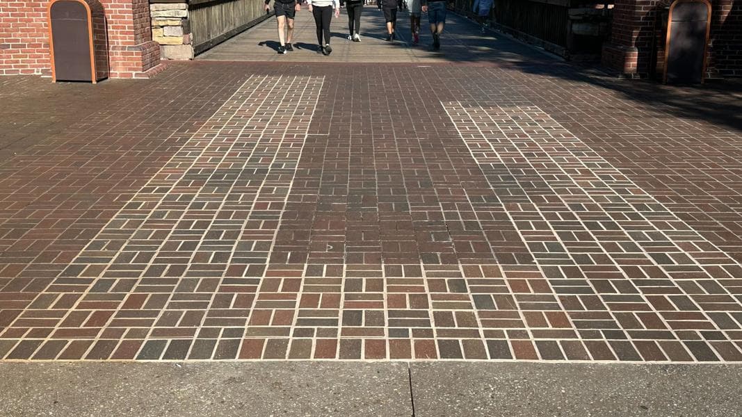 Liberty Square Brickwork Refurbishment Continues Near Bridge in Magic Kingdom