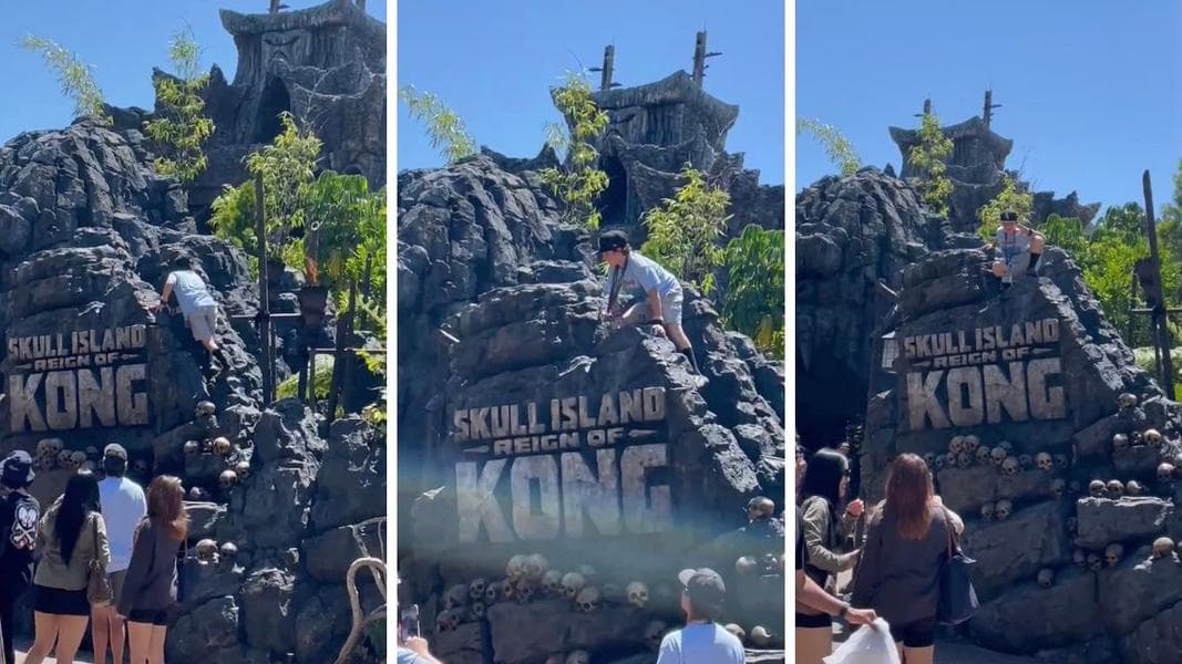 VIDEO: Guest Climbs Skull Island: Reign of Kong Sign for Photo
