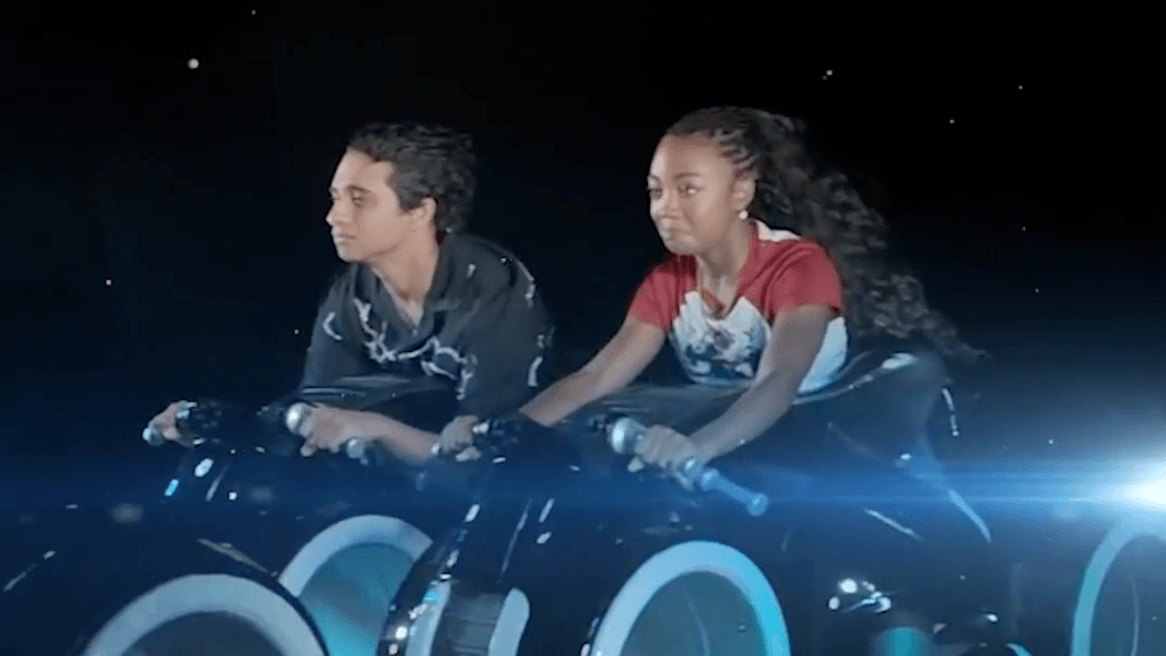 'Percy Jackson' Stars Leah Sava Jeffries and Aryan Simhadri Try Not to React on TRON Lightcycle Run