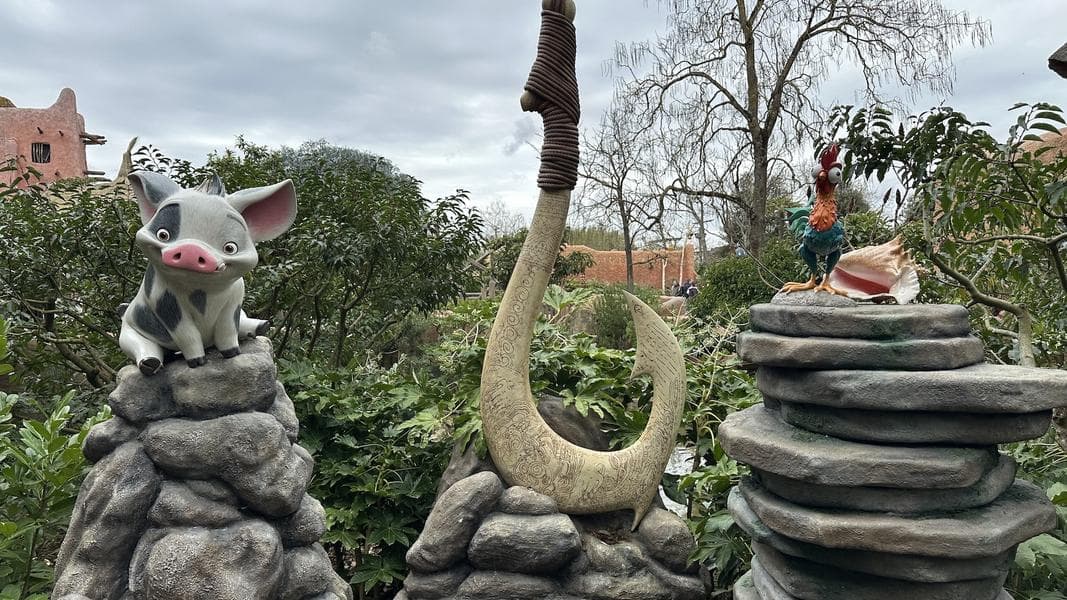 Statues of Hei Hei and Pua Back in Adventureland